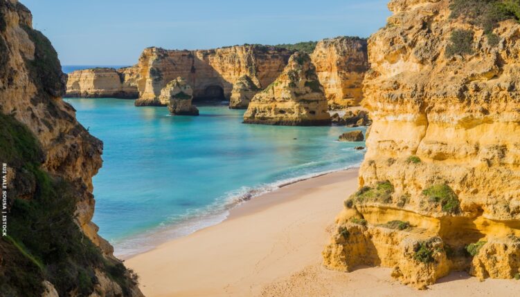 Marinha beach with cliffs and rock stacks