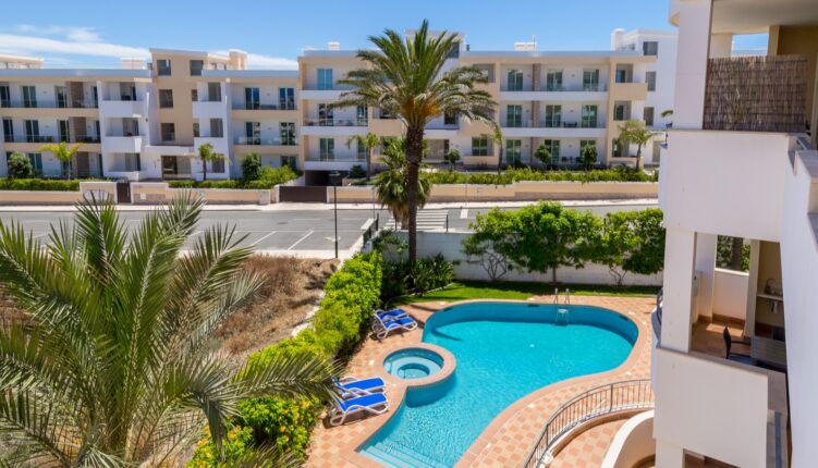 Apartment building with swimming pool and garden