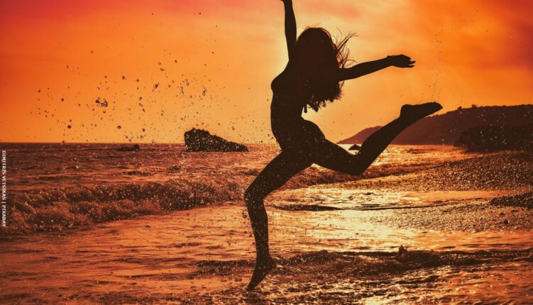 Silhouette of dancer on a beach