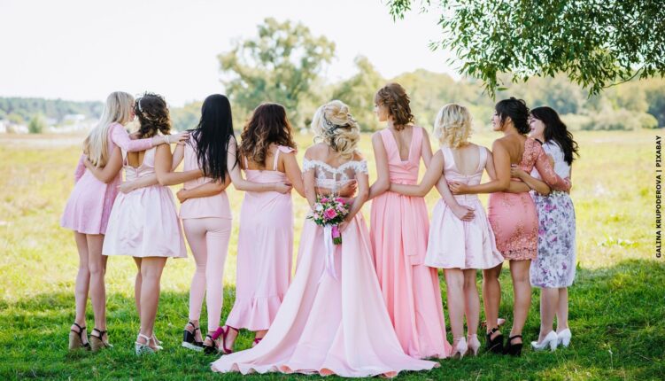 Group of women in field at wedding